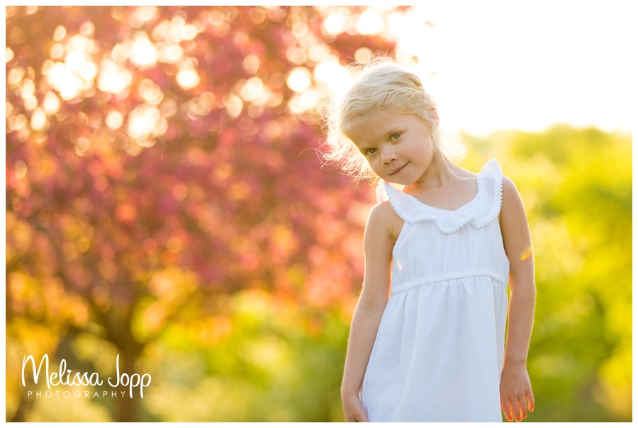 little girl in white dress and apple blossoms mn child photographer